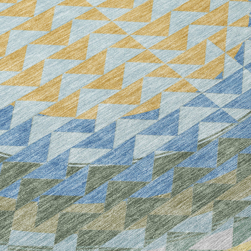 Close-up of round area rug chevron pattern in blue, yellow, white, and green tones