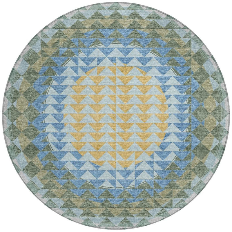 Round area rug with geometric chevron pattern in blue, silver, green, and yellow, flat view