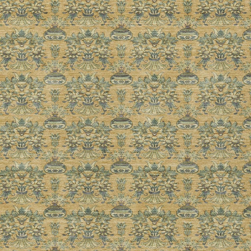 Detailed view of repeating teal damask medallion pattern on gold area rug