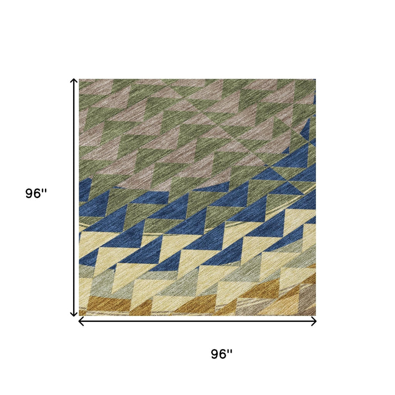 Round area rug, 8 ft diameter, geometric chevron pattern in olive, blue, cream, and rust.