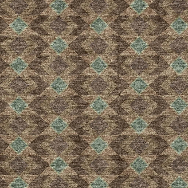 Geometric area rug surface with brown and teal repeating diamond design