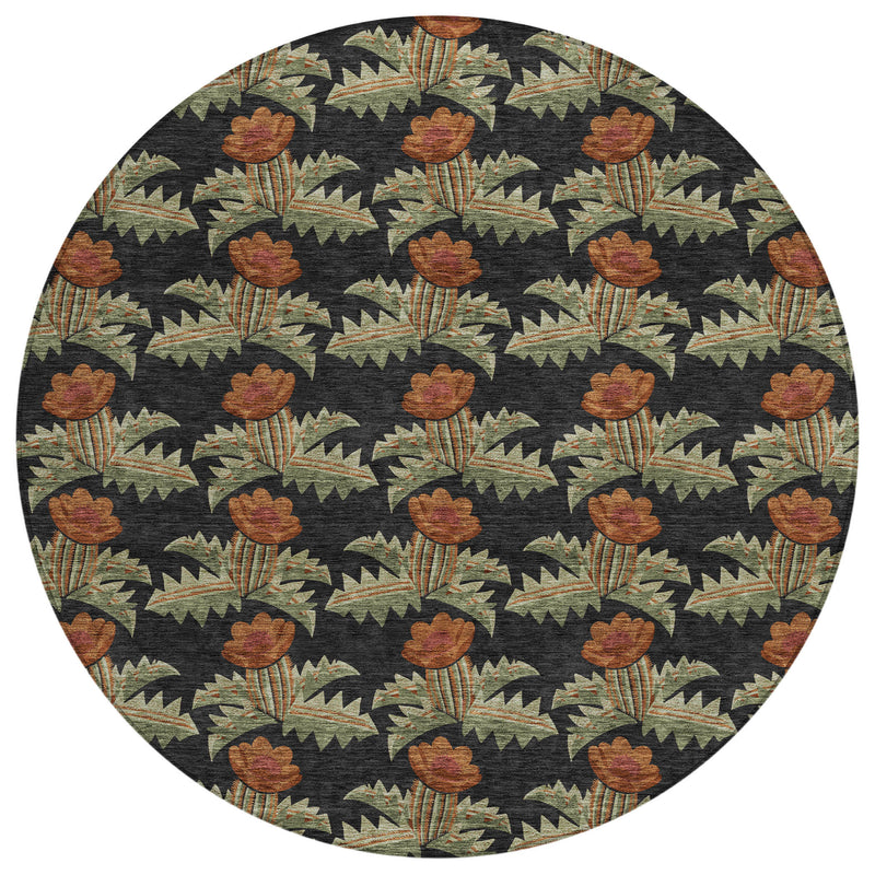 Round area rug with black base, brown-orange floral design, and muted green accents