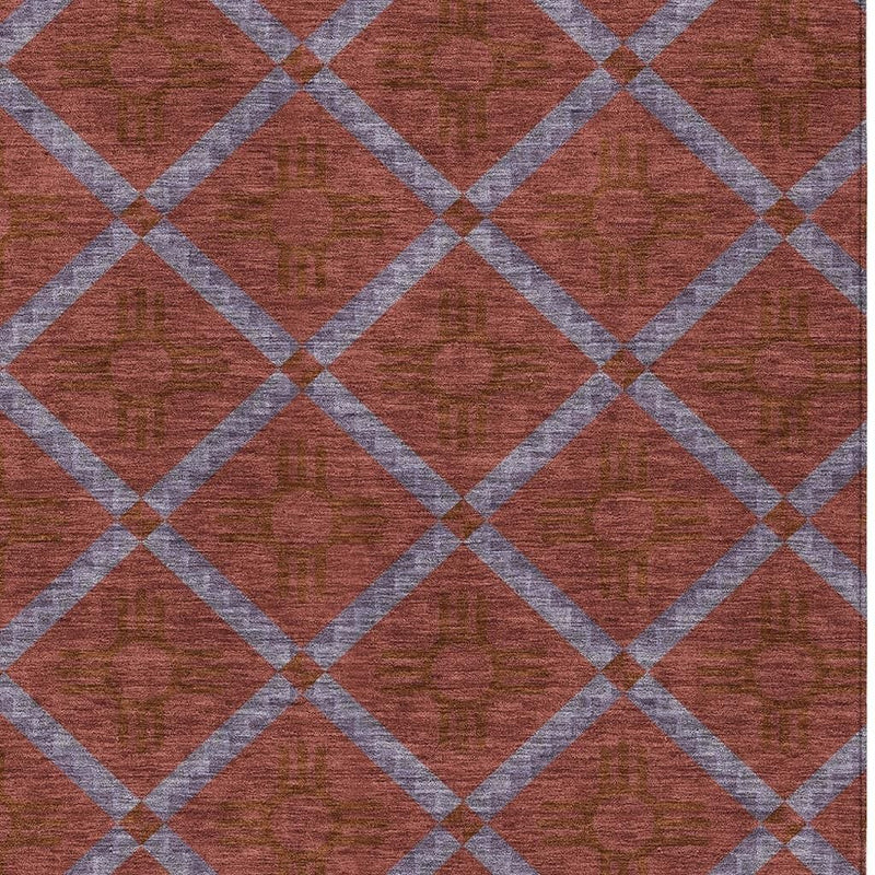 Close-up of geometric area rug: maroon diamonds with light gray crisscross lines
