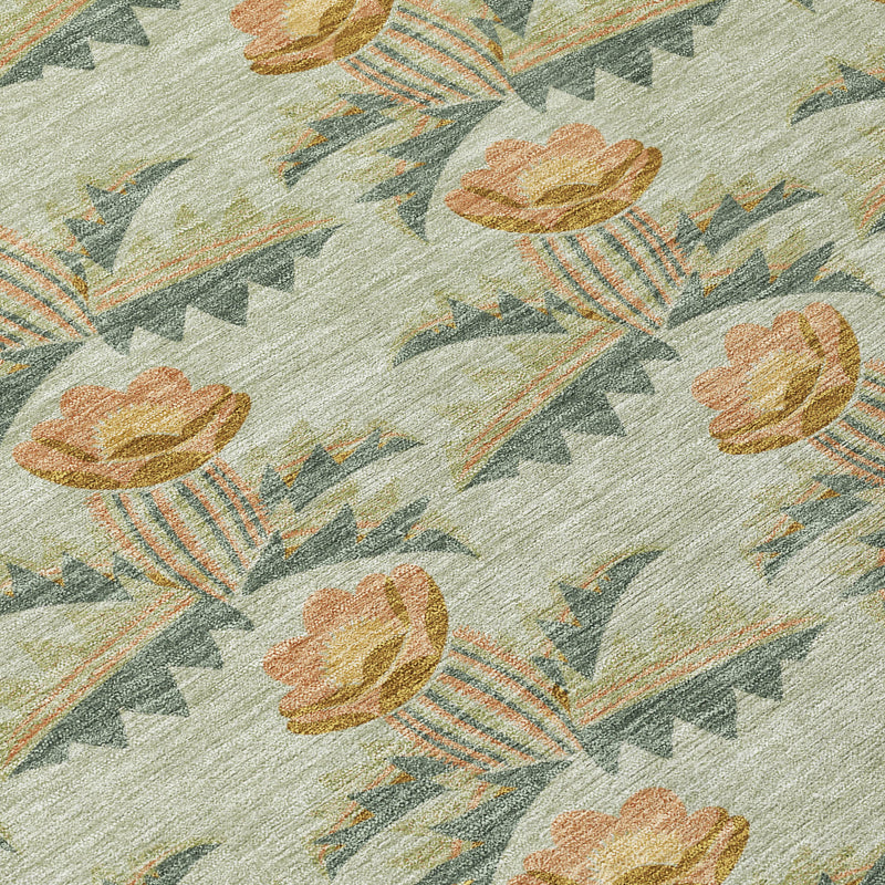 Floral area rug close-up with sage green ground, terracotta tulips, and arrow stripes