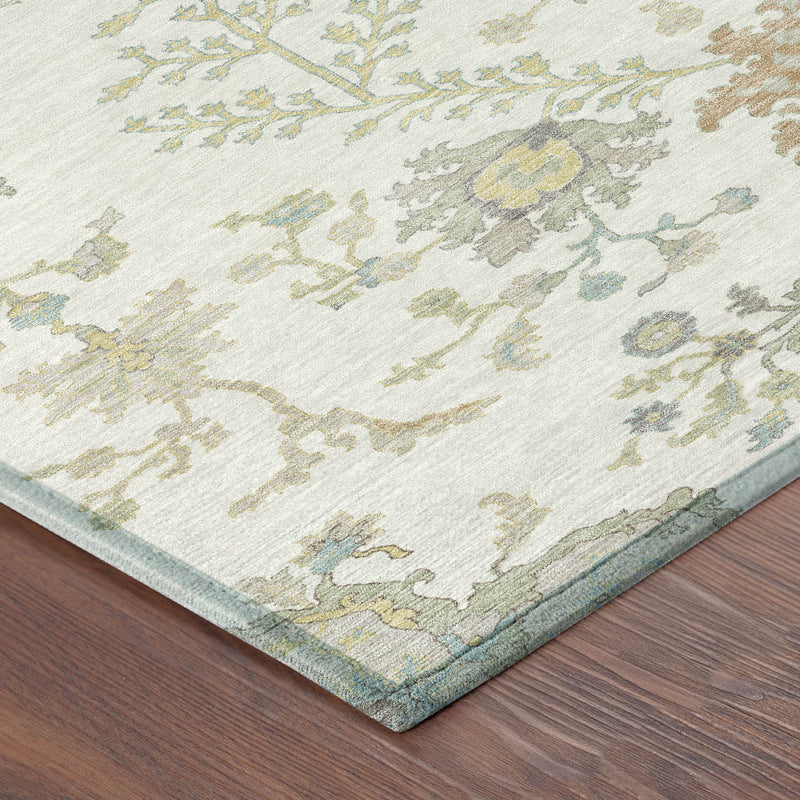 Ivory oriental area rug corner detail with botanical pattern and blue-green border