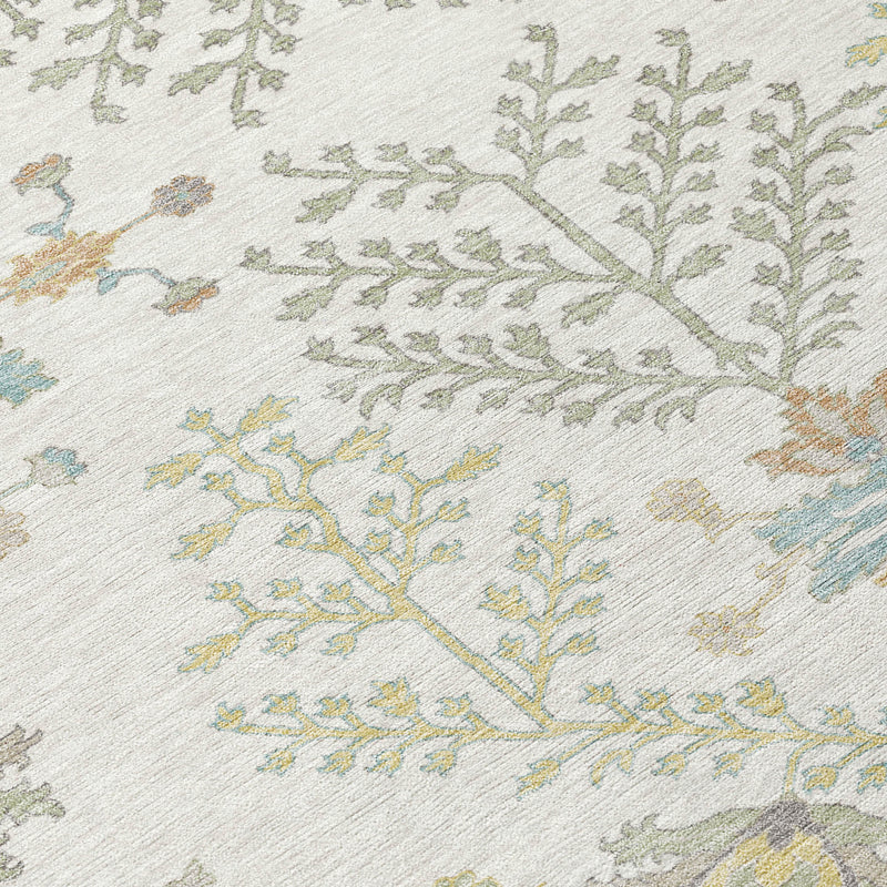 Ivory oriental rug close-up with leafy vines and small floral accents in blue, green, tan