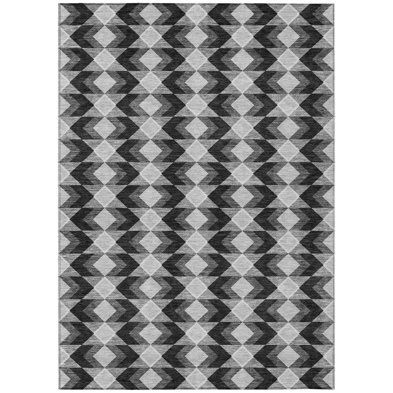 Rectangular area rug with black, gray, and white diamond and zigzag geometric design