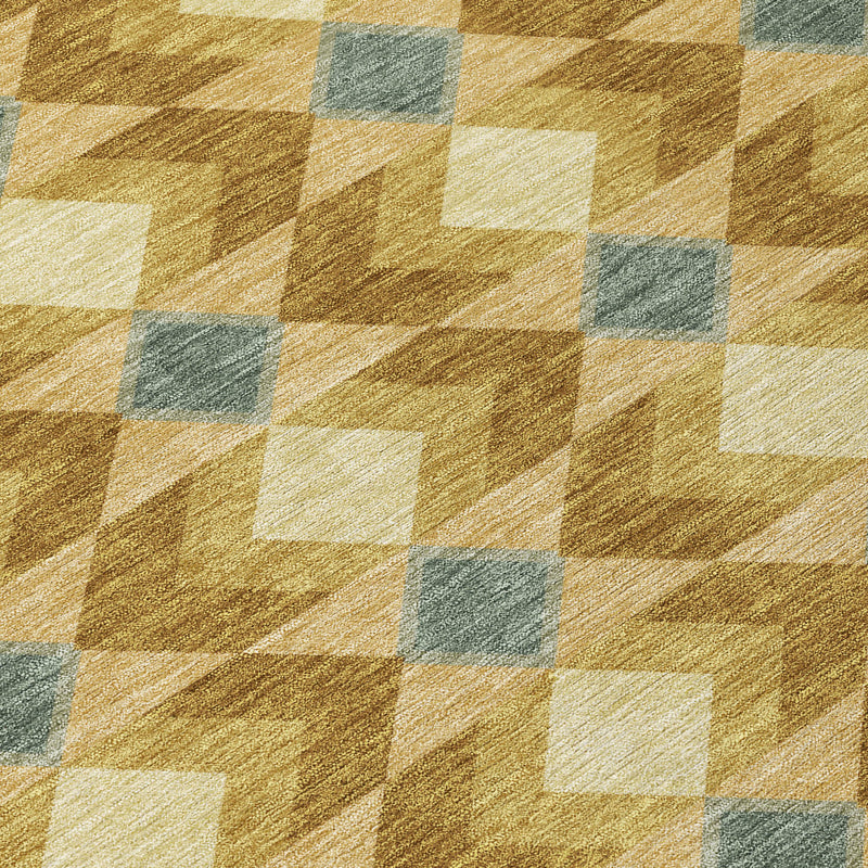 Close-up of tan, brown, and blue geometric rug squares with distressed weave texture.