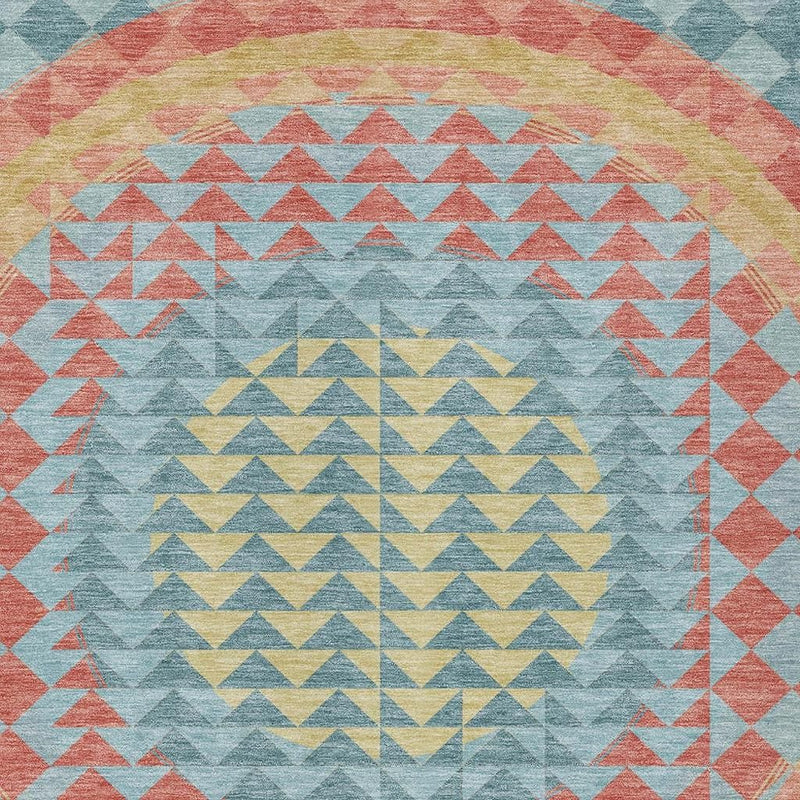 Teal blue geometric area rug with zigzag chevrons and coral, yellow, and gray accents