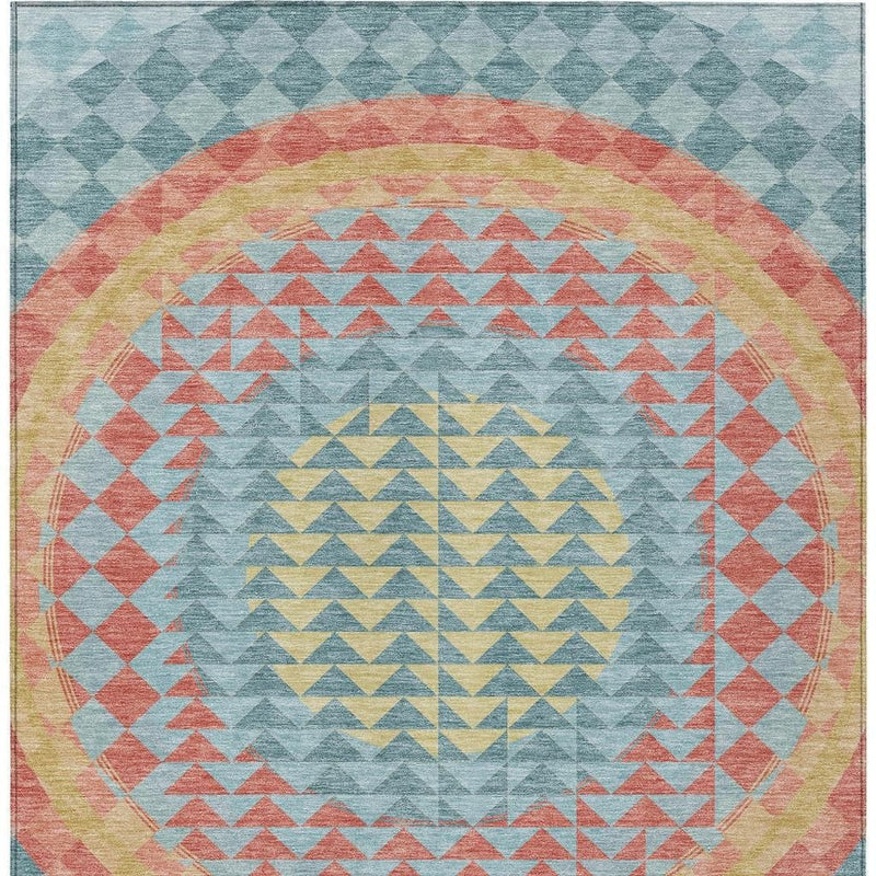 Full teal blue geometric area rug with circular medallion and chevron pattern in coral and yellow