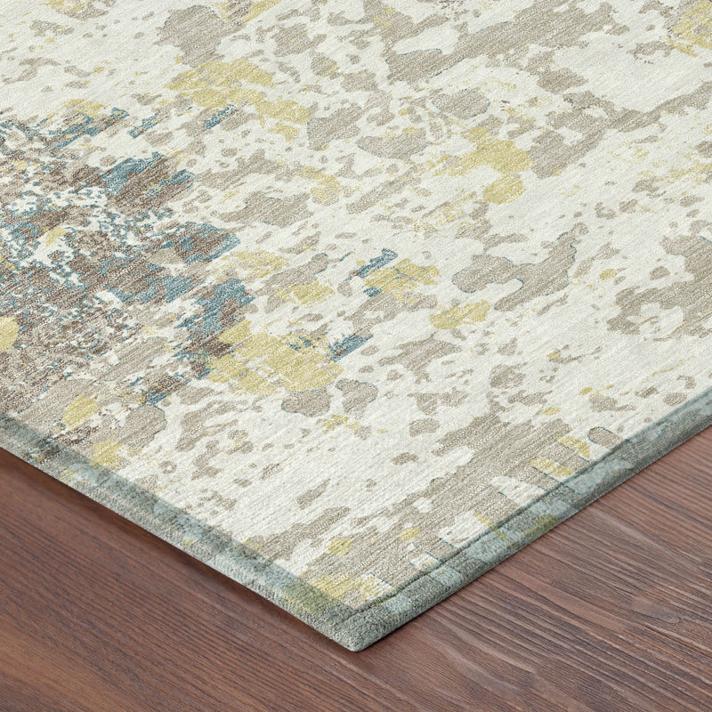 Ivory abstract area rug corner with beige, gray, yellow, and blue distressed pattern and border