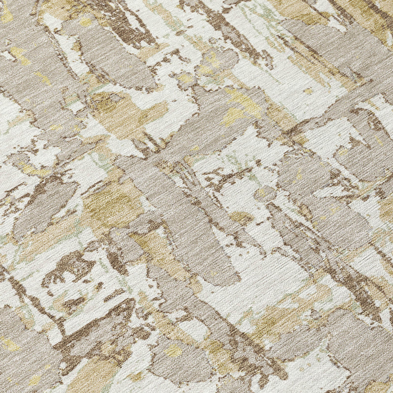 Ivory and beige abstract washable indoor/outdoor area rug with distressed mottled pattern