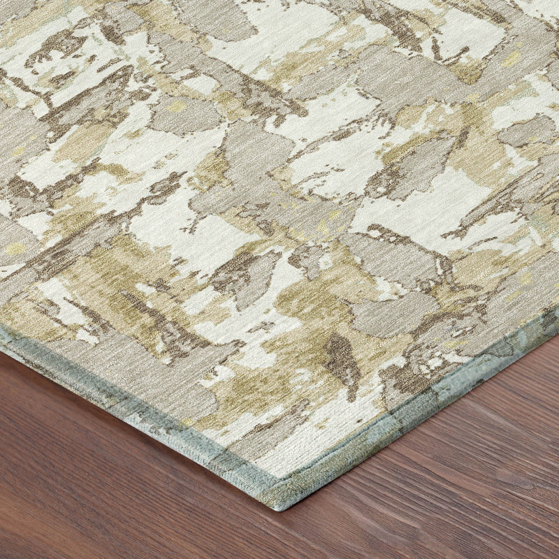 Corner view of ivory and beige abstract area rug with textured distressed pattern