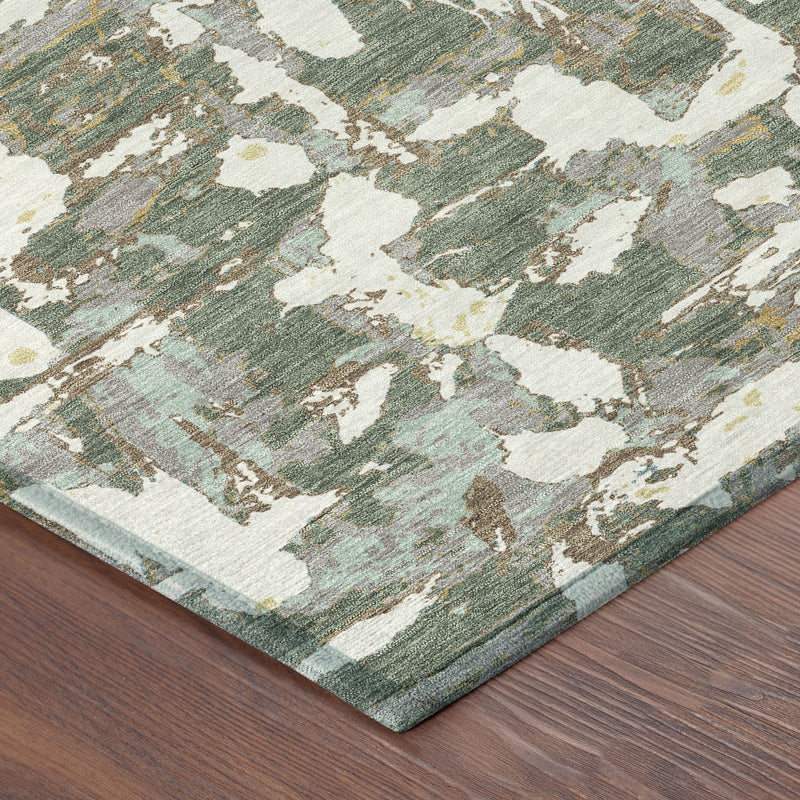 Area rug with abstract distressed pattern in green and beige, low pile with flat border