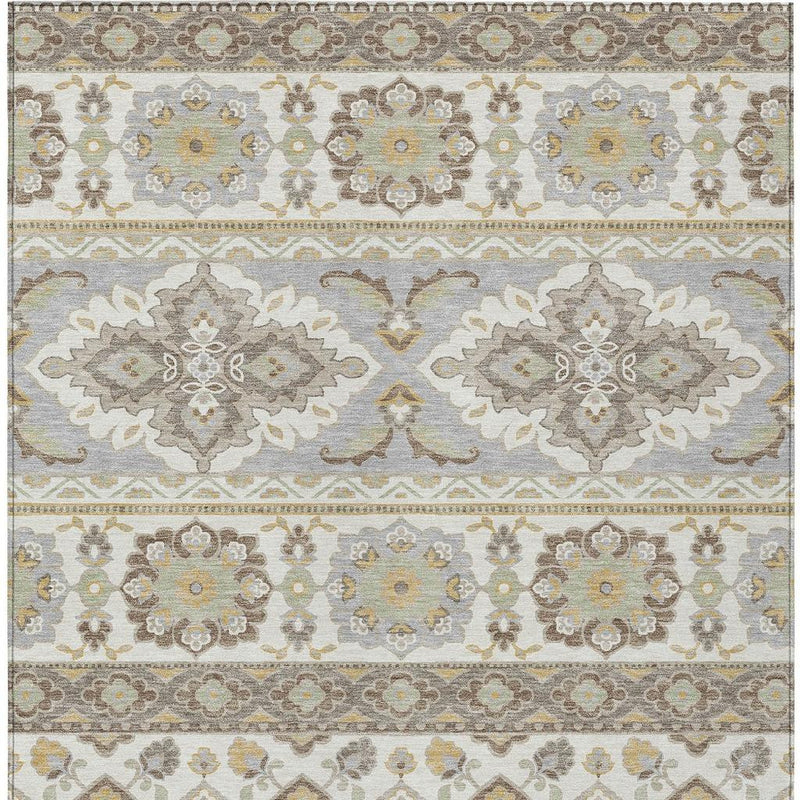 Ivory and silver tribal rug detail with two large floral medallions and borders