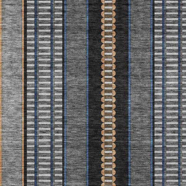Striped indoor outdoor area rug with dark gray, blue, white, and copper bands