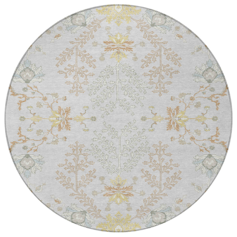 Round area rug showing light gray field with gold and ivory scrolling vines and flowers