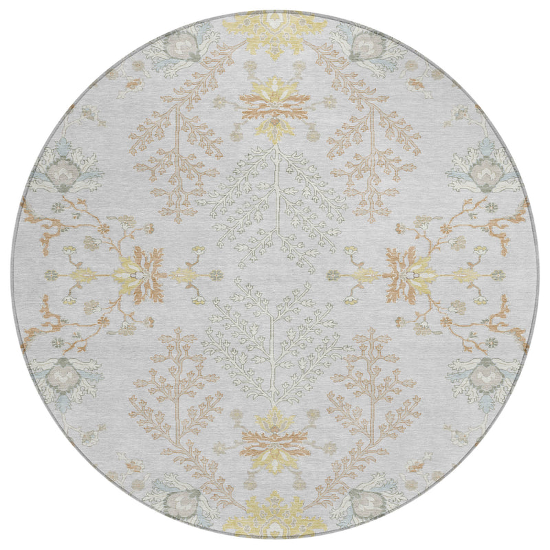 Round area rug with light gray base and ornate ivory floral and vine medallion design
