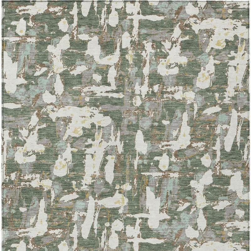 Abstract green and beige area rug close view with distressed streaks and speckles
