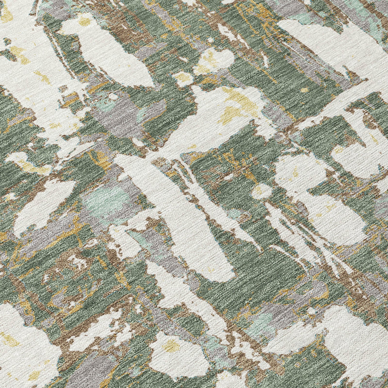 Close-up of green and beige abstract area rug texture with white distressed shapes