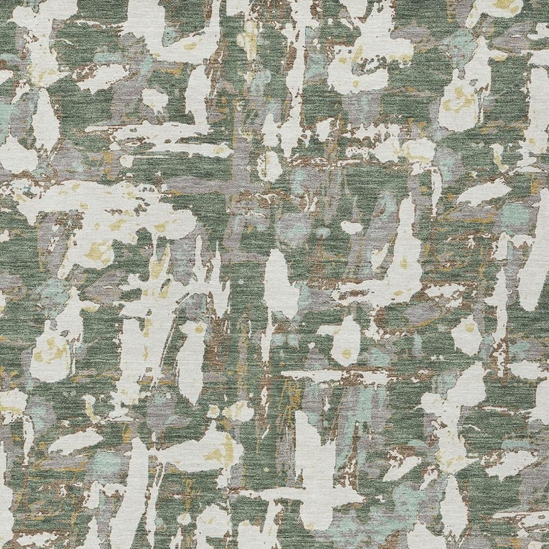 Green and beige abstract area rug detail with worn white and muted teal sections