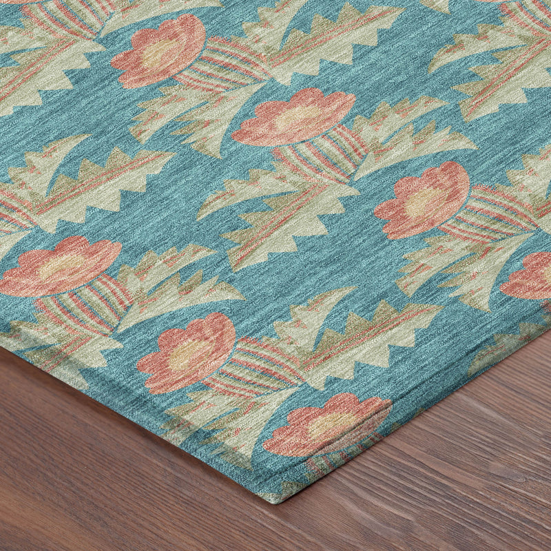 Turquoise floral area rug with coral blooms and jagged geometric motifs, corner view