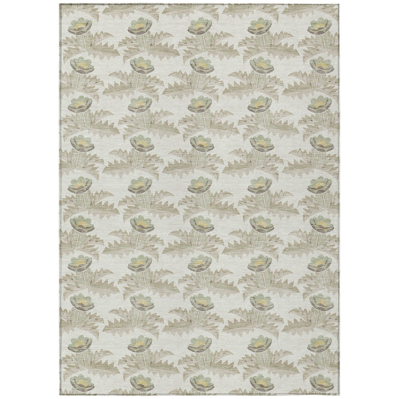 Ivory area rug with repeating oval flower and leaf motifs in muted brown and green