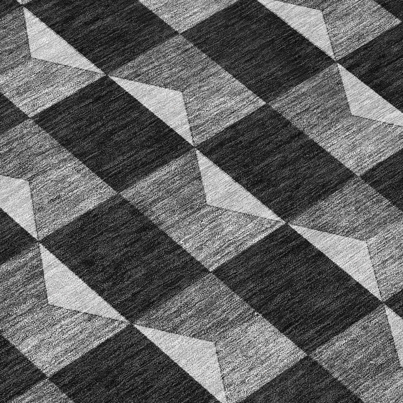 Geometric area rug with black, gray, and ivory checker and chevron pattern
