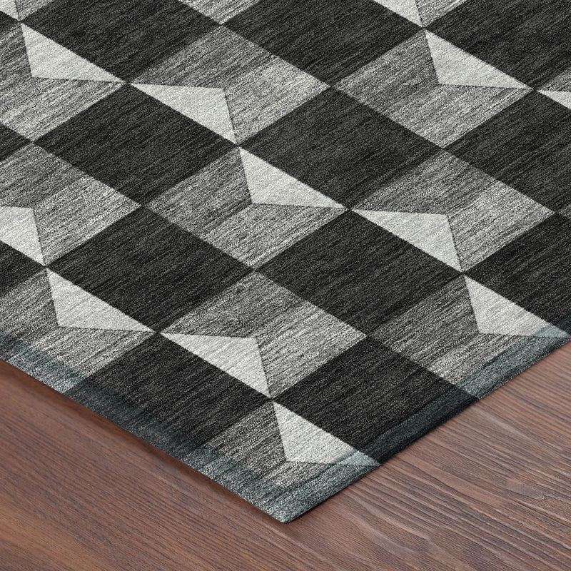 Corner view of geometric black and ivory area rug with checkered pattern