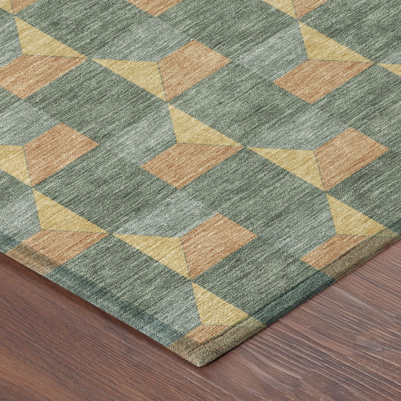 Geometric area rug corner view with green-gray texture and orange/yellow cube pattern