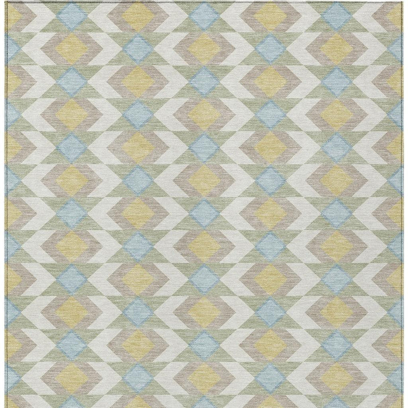 Ivory area rug with repeating blue, yellow, and green geometric chevron pattern