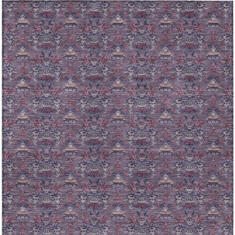 Plum and gray rectangular area rug with dense repeating floral medallions.