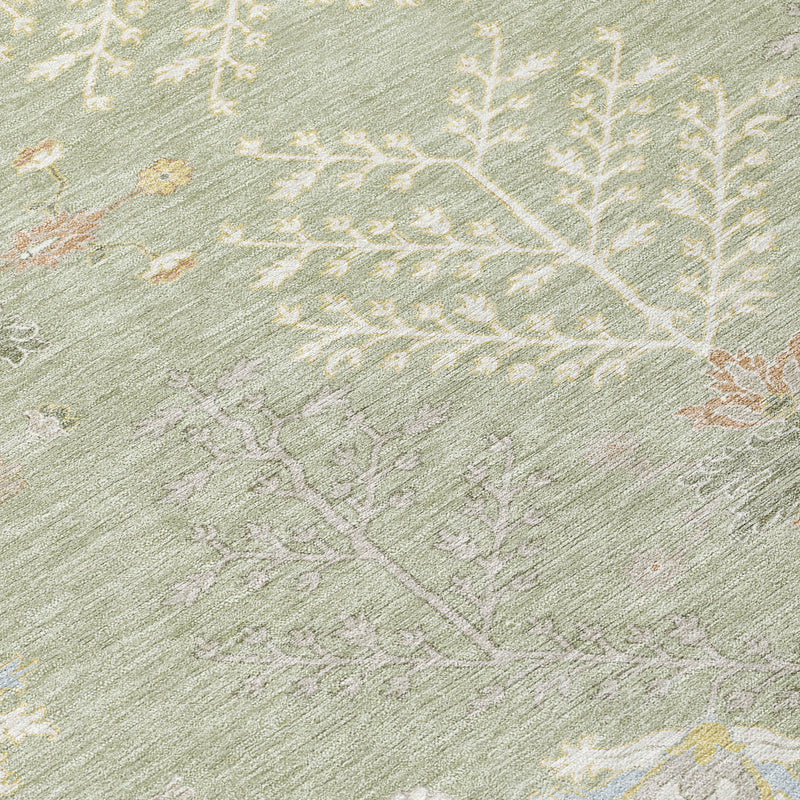 Close-up of green oriental rug with ivory and muted orange botanical pattern