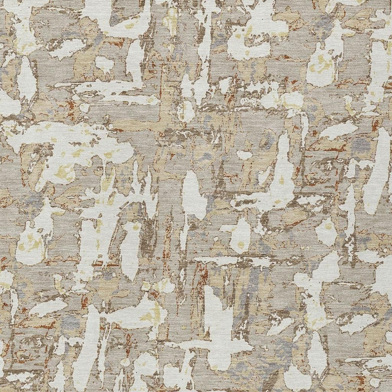 Beige and gray abstract area rug close-up showing layered, worn shapes