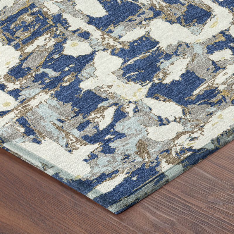 Corner detail of navy and beige abstract area rug with flat woven edge
