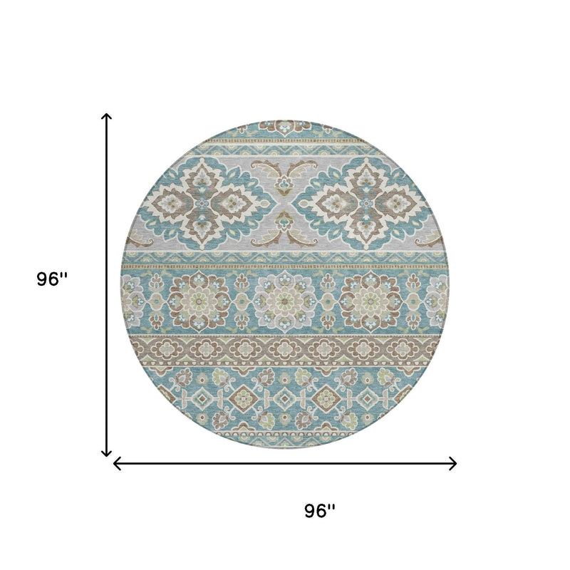 Round indoor outdoor area rug, 96 in wide, teal and green tribal medallion pattern