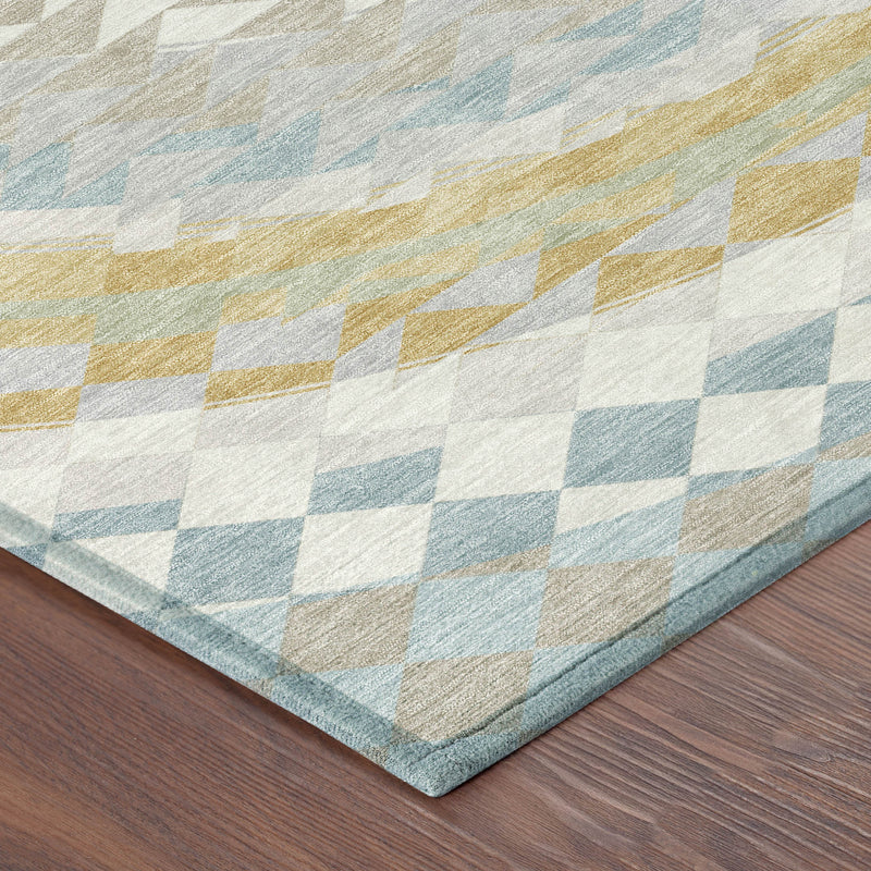 Corner view of geometric area rug with light blue, ivory, and gold-toned diamond blocks.