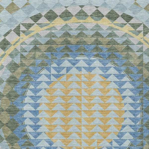 Geometric area rug with blue, silver-gray, green, and yellow chevron patterns