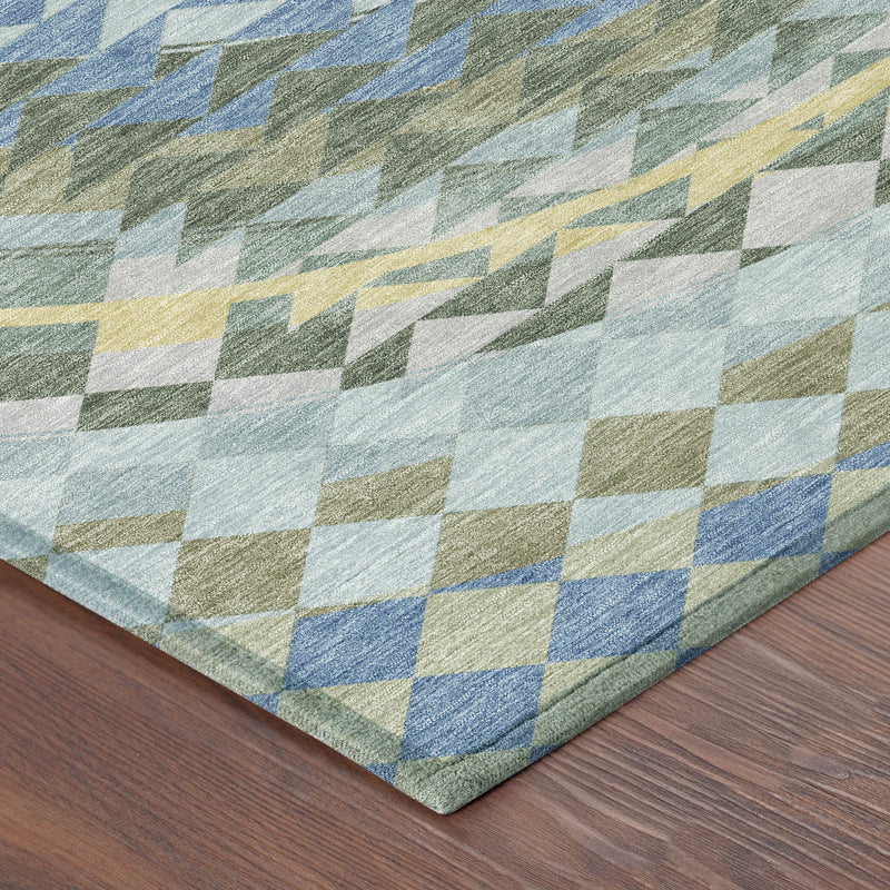 Geometric area rug corner with blue and green checkered blocks on light background