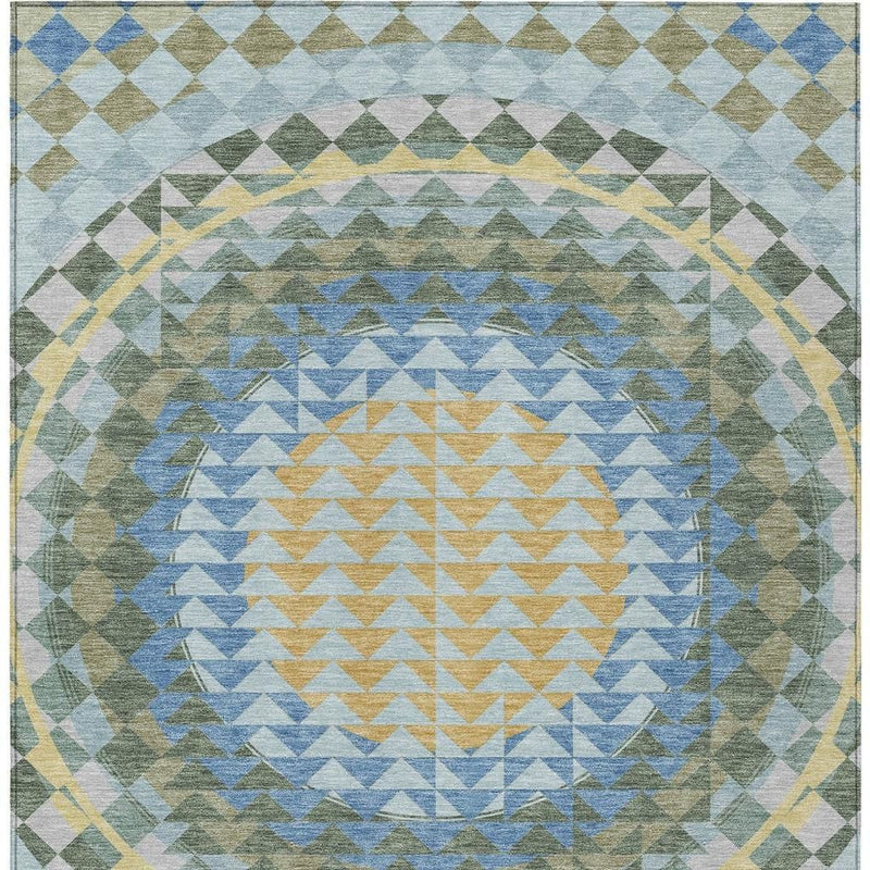 Geometric area rug top view with layered chevrons in blue, green, gold, and gray