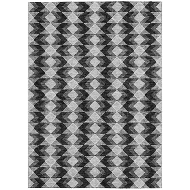 Geometric area rug with repeating diamond and zigzag pattern in black, gray, and white.