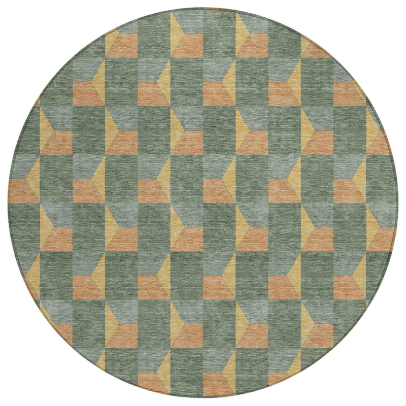 Round area rug featuring green-gray geometric cubes in tan, yellow, and orange