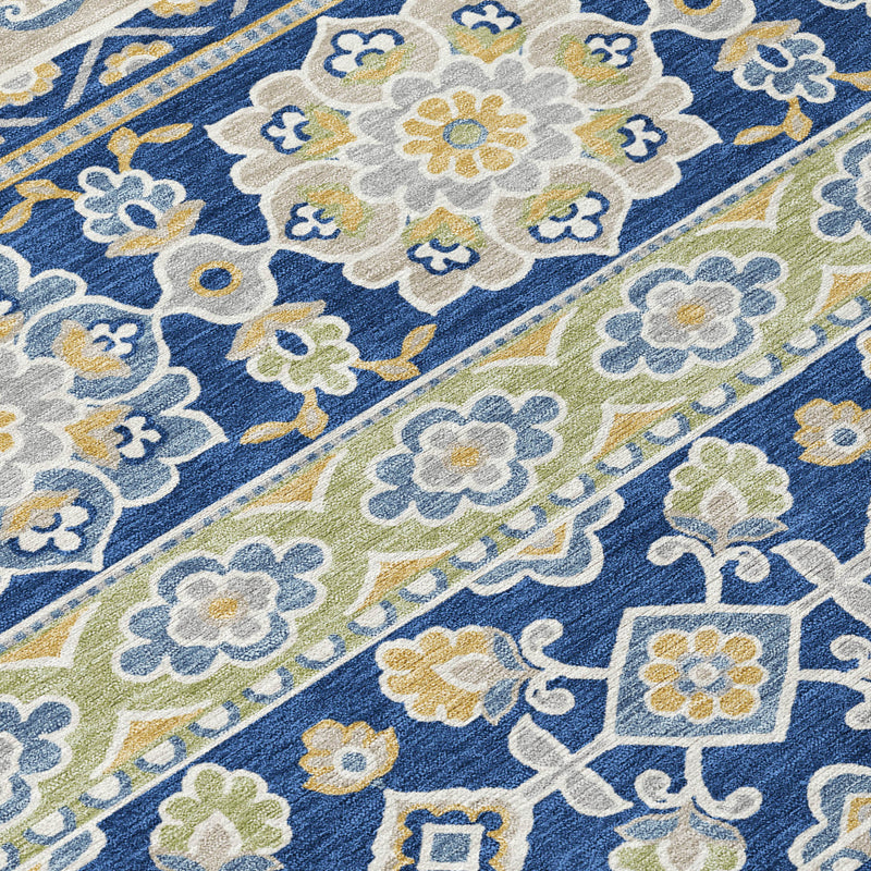 Navy and beige tribal area rug with repeating floral medallions and diamond accents