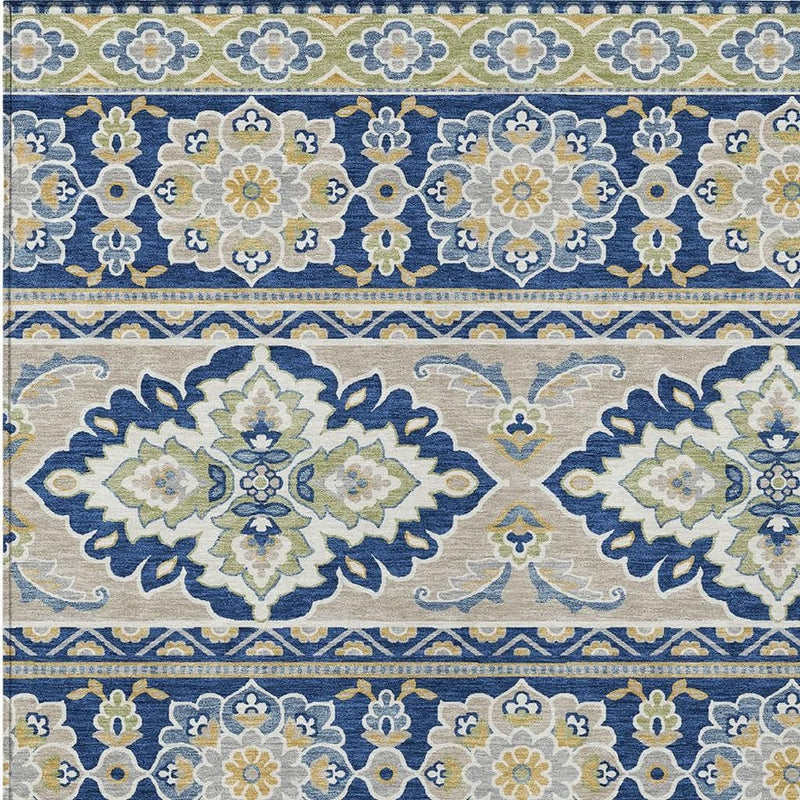 Navy and beige tribal area rug close-up with repeating floral blocks and border pattern