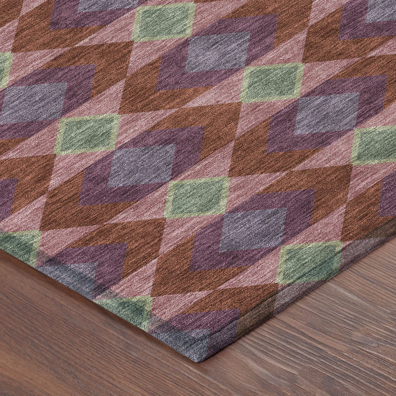 Close-up of geometric diamond rug pattern in burgundy, gray, green, and tan