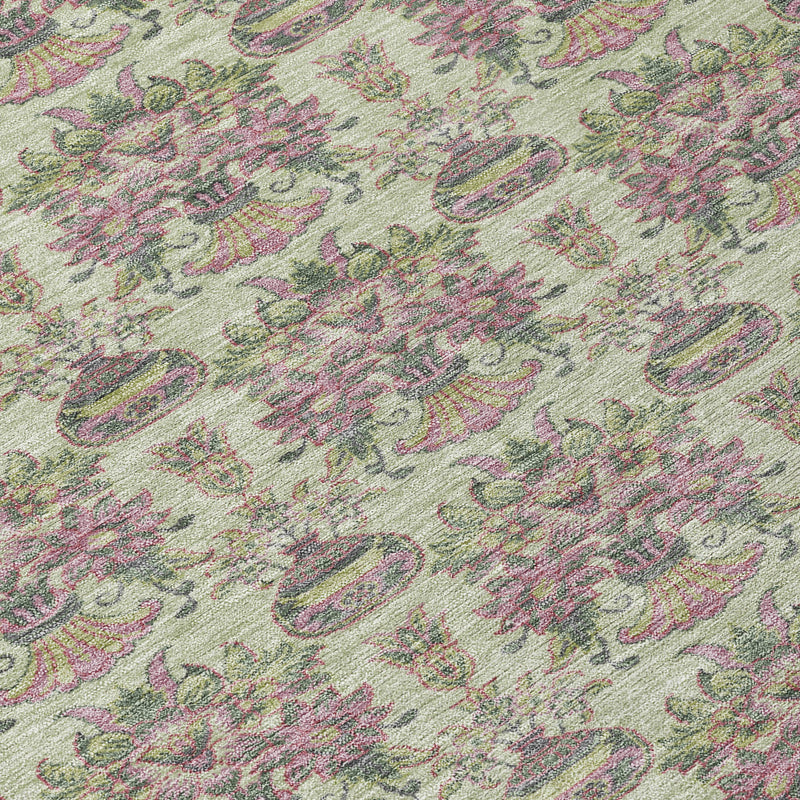 Close-up of round area rug pattern with repeating floral and oval medallion motifs