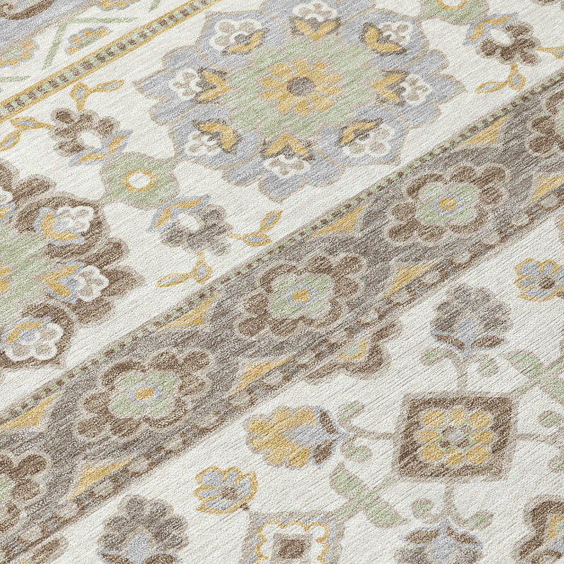 Textured close-up of ivory and silver tribal rug with stitched motif details