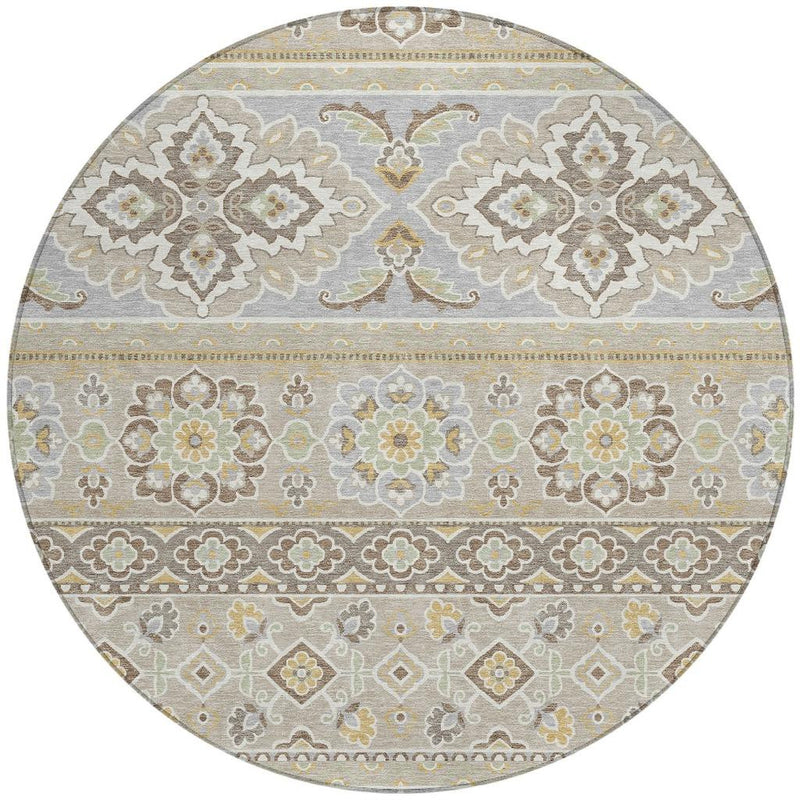 Round indoor-outdoor rug with horizontal tribal bands and repeating floral medallions.