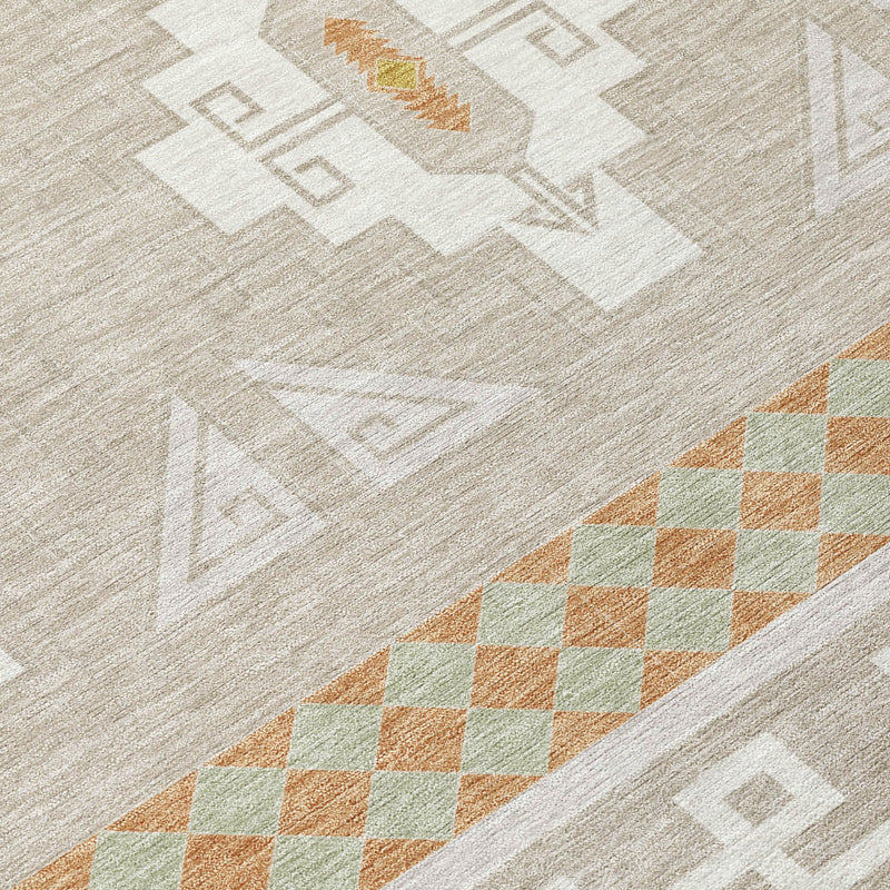 Close-up of light gray rug texture with white tribal icons and orange-green diamond border.
