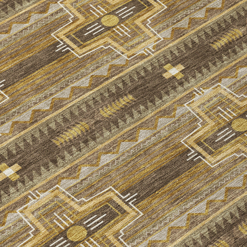 Geometric tribal pattern on chocolate brown rug with tan lines and gold accents